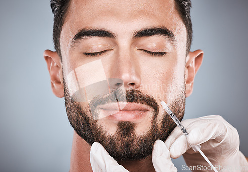 Image of Needle, man and plastic surgery for skincare, collagen and beauty clinic in studio. Botox cosmetics, face injection and male aesthetic for body transformation, change and facial filler on background