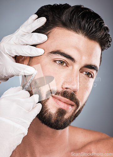 Image of Filler, man and facial injection for skincare, collagen and beauty clinic in studio. Plastic surgery, face needle and male aesthetic for body transformation, cosmetics change and botox on background