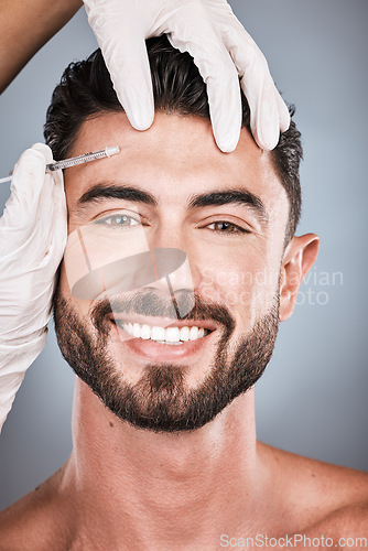 Image of Needle, man and portrait for skincare, beauty and collagen aesthetic in studio. Botox cosmetics, face injection and male model smile for plastic surgery, transformation or facial filler on background