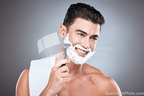 Image of Shaving cream, face and man with razor in studio isolated on a gray background. Epilation, cleaning and thinking male model with facial product, foam or gel to shave for wellness and hair removal.