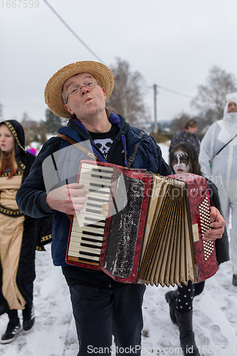 Image of Peoples in mask attend Masopust or the Mardi Gras carnival, traditional ceremonial door-to-door procession. 