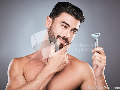 Image of Face, man thinking and razor for shaving in studio isolated on a gray background. Ideas, haircare and male model with facial tool or product to shave for wellness, health hygiene and hair removal.