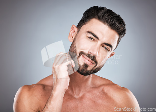 Image of Skincare, beard and portrait of man with smile, hands on face and hair care maintenance. Fitness, health spa facial care and happy male model with strong muscle in studio isolated on grey background.