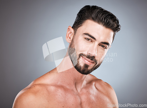 Image of Skincare, smile and health, portrait of man with happy face, hair and beard growth and maintenance. Fitness, health and spa facial care, male model with muscle in studio isolated on grey background.