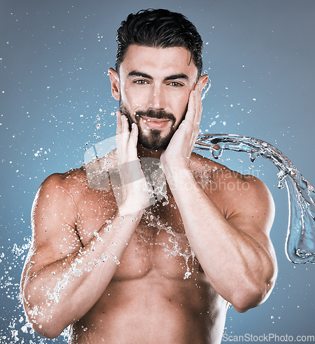 Image of Water splash, face and shower with man in portrait for beauty and skincare isolated on studio background. Smile, facial and cleaning body with muscle, sustainable dermatology with natural cosmetics