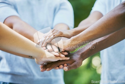 Image of People, diversity and hands together for community, trust or collaboration in partnership in the outdoors. Hand of team piling or joining in unity for agreement, coordination or support in solidarity