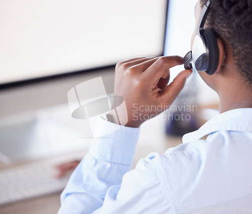 Image of Back of man, call center and customer service on computer for crm telemarketing support. Sales consulting, help desk consultant or lead generation on headset, desktop website or telecom communication