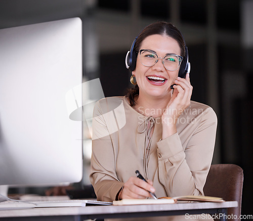 Image of Call center, woman and writing notes for customer service, telemarketing sales and consulting at computer. Happy receptionist, communication and planning in notebook, solution and telecom management