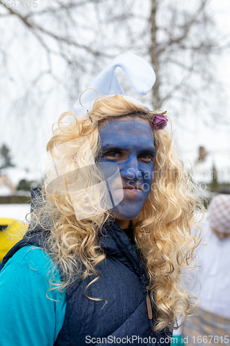 Image of Peoples in mask attend Masopust or the Mardi Gras carnival, traditional ceremonial door-to-door procession. 