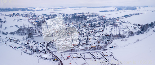 Image of Aerial view of village with residential buildings in winter.