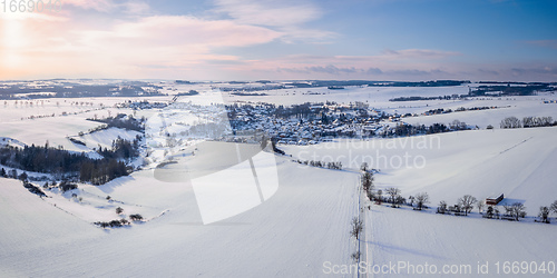 Image of Aerial view of village with residential buildings in winter.