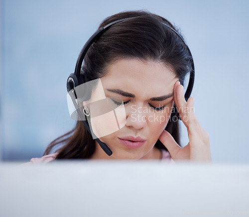 Image of Stress, headache or consultant in call center with burnout, fatigue or migraine pain at customer support. Anxiety, depression or sick sales woman in a crm telemarketing or communications company