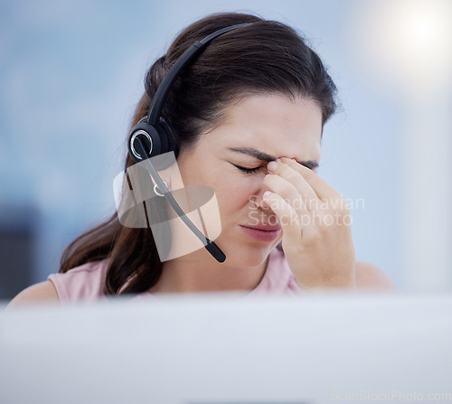 Image of Stress, headache or woman in call center with burnout, fatigue or migraine pain at customer services. Anxiety, depression or sick sales consultant in a crm telemarketing or communications company