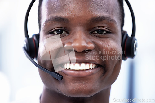 Image of Crm, portrait or happy black man consulting in call center helping, consulting or talking at customer support. Smile, face or African sales consultant in a telemarketing or communications company