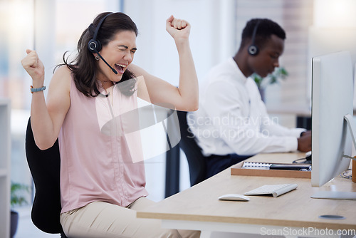 Image of Success, winner or excited consultant in call center happy with telemarketing sales target or goals. Fists, CRM communication or woman celebrates winning an achievement or bonus deal at IT support