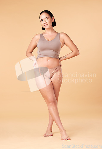 Image of Portrait, woman and body positivity for empowerment, underwear and skincare on studio background. Face, female or lady in bikini, confidence or beauty with motivation, fitness or wellness on backdrop