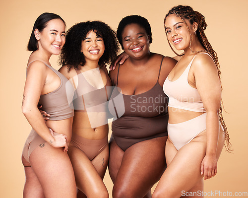 Image of Body, diversity and portrait of different women group hug for inclusion, beauty and skincare. Aesthetic model people or friends on beige background with glow, underwear and motivation for self love
