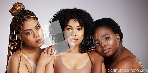 Image of Portrait, skincare and diversity with woman friends in studio on a gray background together for beauty. Face, makeup and natural with a female model group posing to promote support or inclusion