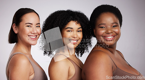 Image of Women, diversity studio portrait and smile for aesthetic, beauty or race equality with plus size solidarity. Model, asian and black woman with cosmetic, makeup and wellness with support for inclusion