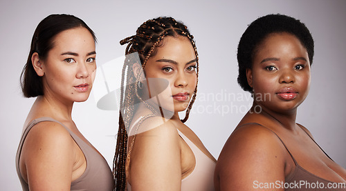 Image of Women, diversity and studio portrait with support for trust, underwear or skincare for beauty aesthetic. Model, asian and black woman with inclusion, makeup or wellness with skin health by background