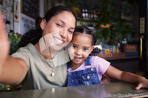 Image of Cafe, black family and selfie with a mother and daughter enjoying spending time together in a coffee shop. Portrait, kids and smile with a woman and happy female child bonding in a restaurant