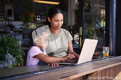 Image of Black family, internet cafe or laptop with a mother and daughter together in the window of a restaurant. Kids, computer or education with a woman and female child sitting or bonding in a cafe