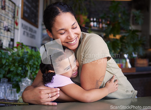 Image of Cafe, mother and kid hug in restaurant for love, care and quality time together. Happy parent hugging girl child in coffee shop at table for happiness, smile and embrace for bonding, relaxing and fun