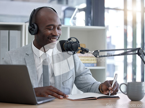 Image of Radio host, black man and networking with laptop, smile and writing for interview, speaking and business influencer. Presenter, African male and speaker with notebook, microphone and audio broadcast