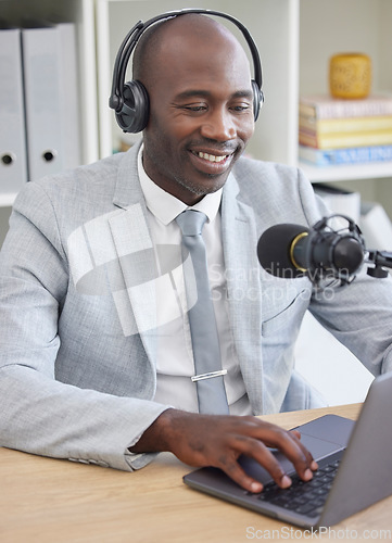 Image of Radio, laptop and black man on microphone, professional podcast or content creation in office for media broadcast. Virtual reporter, news speaker or journalist speaking on live streaming, audio show