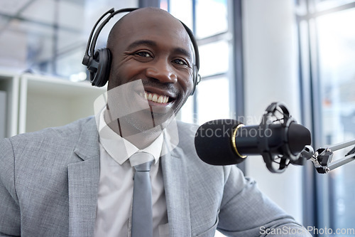 Image of Radio, portrait and black man on microphone, professional podcast or content creation in business office broadcast. Virtual reporter, news speaker or journalist speaking on live streaming audio show