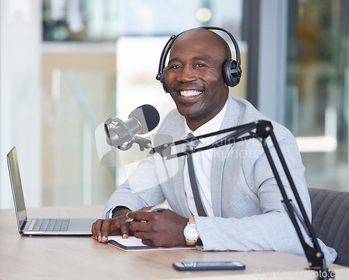 Image of Portrait, laptop and news with a black man radio presenter writing in a notebook during a live broadcast. Computer, podcast and microphone with a male journalist working in media for a talk show