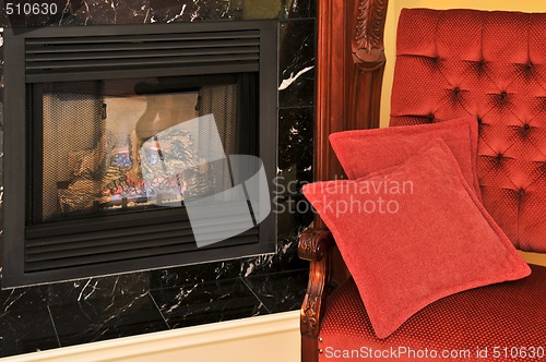 Image of Fireplace and red chair