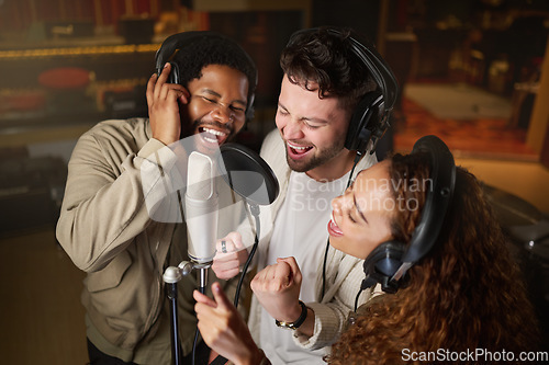 Image of Music, streaming and diversity, band recording in studio singing into microphone with headphones and talent. Technology, art and creative influencer friends with live stream song for record label.