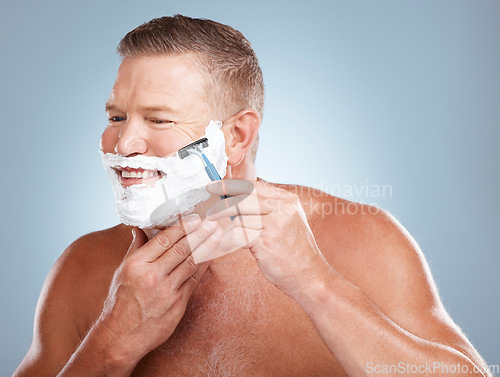 Image of Face, razor and man with shaving cream in studio isolated on a gray background for hair removal. Thinking, skincare and happy senior male model with foam to shave for aesthetics, health or wellness.