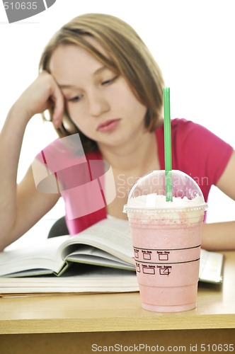 Image of Teenage girl with milkshake