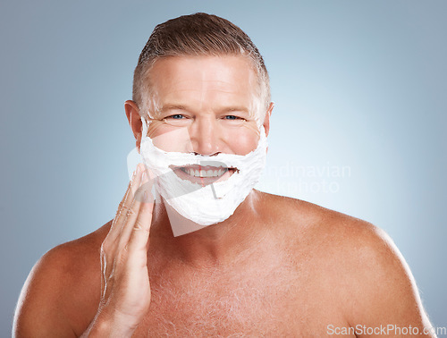 Image of Shaving cream, happy and portrait of old man in studio for skincare, grooming and beauty on grey background. Face, foam and hair removal for mature model smile for skin, beard and shampoo product