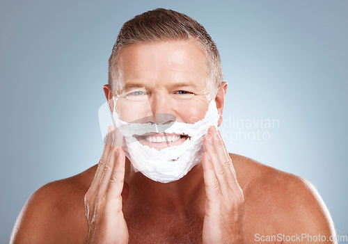 Image of Shaving cream, portrait and happy old man in studio for skincare, grooming and beauty on grey background. Face, foam and hair removal for mature model smile for facial, skin or product while isolated