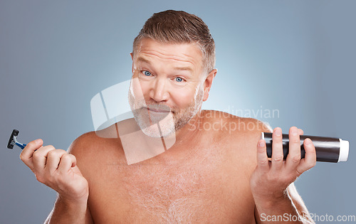 Image of Senior man with razor, foam for shaving and beauty, ready for facial hair removal and skincare on studio background. Portrait, cosmetic product and tools in hands, natural cosmetics for face