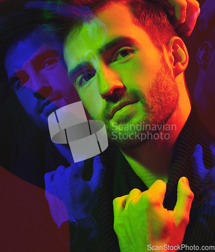 Image of Double exposure, cyberpunk and portrait of a man in color isolated on a dark background in studio. Futuristic, art and model in creative, neon and aesthetic lighting with overlay on a black backdrop