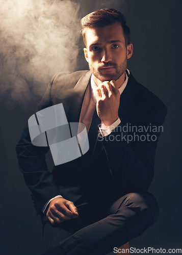 Image of Portrait, smoke and man in suit, fashion and stylish guy against dark studio background. Face, male leader and gentleman with confidence, manager and leader for business, elegant outfit and executive