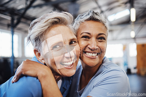 Image of Mature women, portrait or hug in workout, gym or training healthcare wellness, bonding activity or exercise class. Smile, happy and retirement fitness friends in teamwork goals or community support