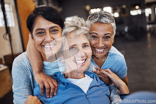 Image of Mature women, portrait and hug in gym, workout or training healthcare wellness, bonding activity or exercise class. Smile, happy and retirement fitness friends in diversity group or community support