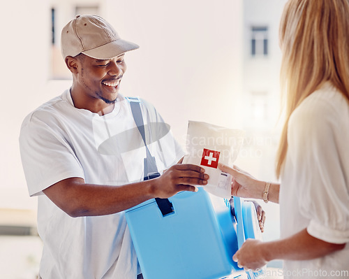 Image of Healthcare, delivery and supply with a courier black man making a delivery to a woman in her home. Medical, shipping and service with a male in a house to deliver a package to a female customer