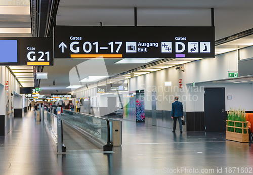 Image of Peoples walking in Vienna airport terminal