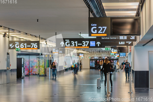 Image of Peoples walking in Vienna airport terminal