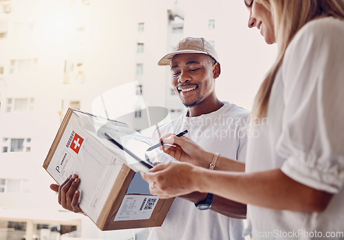 Image of Black man, tablet or woman signing for delivery, courier parcel or cardboard box package in house or home. Smile, happy or postal worker technology for customer signature, shipping or logistics order
