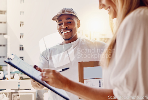 Image of Black man, clipboard or customer signing for delivery, courier parcel or cardboard box package in house or home. Smile, happy or logistics worker and paper documents for woman, shipping or post order