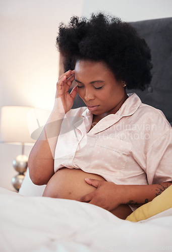 Image of Pregnant, headache and black woman with depression, bedroom and stress with cramps, frustrated and healthcare. Pregnancy, African American female and lady with anxiety, mental health and discomfort