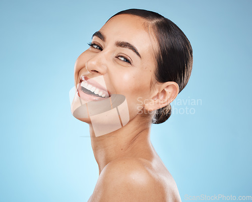 Image of Portrait, skincare and woman with smile, cosmetics and dermatology against blue studio background. Face detox, female and lady with happiness, wellness and morning routine for grooming and treatment