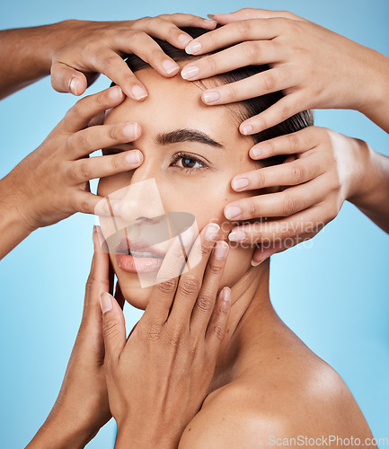 Image of Touching, hands and face of a woman for skincare isolated on a blue background in a studio. Consultation, check and girl with people feeling for facial acne, problem and dermatology on a backdrop